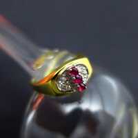 Elegant ladys vintage ring in gold with rubies and diamonds interesting design