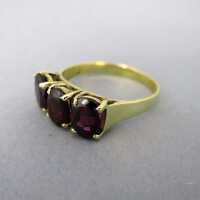 Gold ring with three garnets