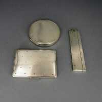 Three-pieces set compact cigarette box and a comb mounted...