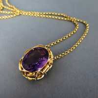 Unusual and wonderful gold pendant with a deep violet amethyst and a chain