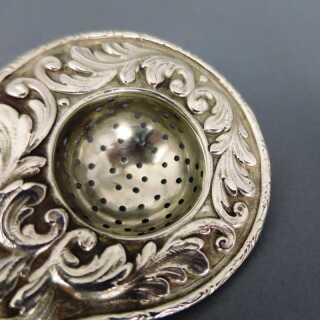 Rich decorated antique silver tea sieve with holder Christoph Widmann Pforzheim