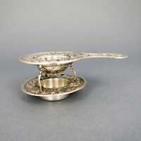 Rich decorated antique silver tea sieve with holder...