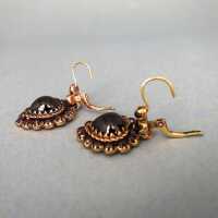 Wonderful gold earrings with hear-shaped red garnet stones