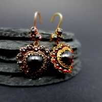 Wonderful gold earrings with hear-shaped red garnet stones