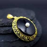 Antique pendant with black onyx and pearl filigree frame in silver and gold