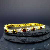 Vintage tenis link bracelet in gold and silver with heart shaped red garnets