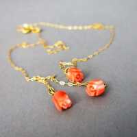 Delicate and elegant womans gold necklace with curved pink coral roses vintage