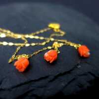 Delicate and elegant womans gold necklace with curved pink coral roses vintage