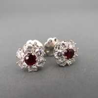Wonderful flower shaped white gold stud earrings with diamonds and rubies