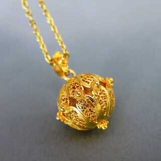 Beautiful gold open worked filigree pendant with long gold chain