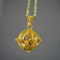 Beautiful gold open worked filigree pendant with long...