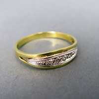 Beautiful ladys gold ring with diamonds partly rhodium...