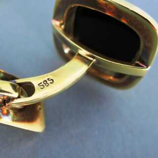 Elegant cufflinks in gold with black onyx slices black tie dresscode