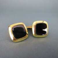 Elegant cufflinks in gold with black onyx slices...