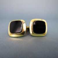 Elegant cufflinks in gold with black onyx slices...