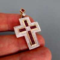 Elegant cross-shaped pendat in gold rich filled with rubies and diamonds