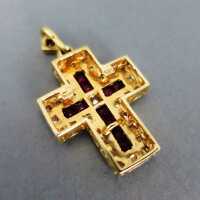 Elegant cross-shaped pendat in gold rich filled with rubies and diamonds