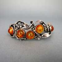 Unique sterling silver abstract bangle with honey amber cabochons