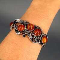 Unique sterling silver abstract bangle with honey amber cabochons