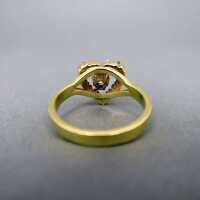 Charming engagement ring in gold heart shaped with diamonds