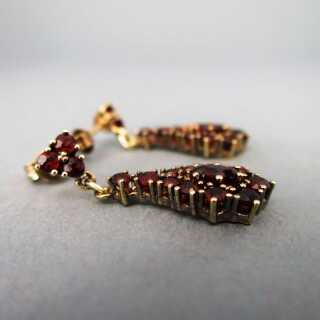 Beautiful drop-shaped stud earrings in gold with deep red garnet stones
