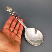 Rich decorated Art Deco cream serving spoon in massive silver