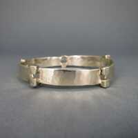 Unique modernist silver bangle with hammered surface and cubical elements