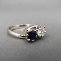 Beautiful 18 k white gold ring with a deep blue sapphire and sparkly diamond