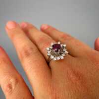 Elegant flower shaped cluster ring in white gold with ruby and diamonds