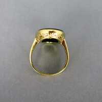 Beautiful gold ring with relief decor and a huge oval black onyx cabochon slice