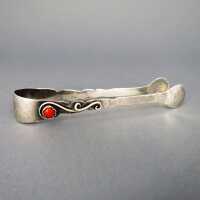 Beautiful Art Deco sugar tongue in silver with red coral...