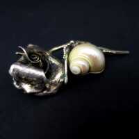 Unique abstract rose brooch in 950 silver with mother of pearl snail
