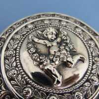 Beautiful Art Nouveau silver and gold pill box with putto and roses garlands