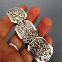 Massive cast silver link bracelet with buddhistic motifs 