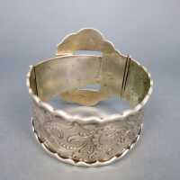 Massive silver belt buckle bangle with rich floral relief