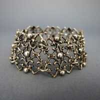Silver link bracelet with heavy open worked filigree design