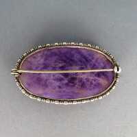 SIlver brooch with a huge violet amethyst quartz cabochon