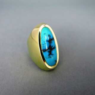 Interesting shaped gold ring with a natural blue turquoise cabochon