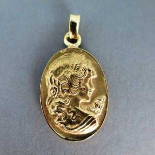Massive cast 18 k gold pendant with womans head in relief