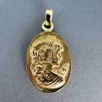 Massive cast 18 k gold pendant with womans head in relief