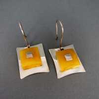 Gorgeous earrings in sterling silver with yellow egg yolk butterscotch amber