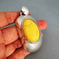 Big sterling silver pendant with huge egg yolk yellow opaque amber cabochon