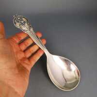Silver Art Deco serving spoon with leaf and tendril decor...