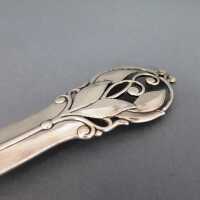 Silver Art Deco serving spoon with leaf and tendril decor...