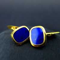 Elegant gold cufflinks with deep blue lapis lazuli slices