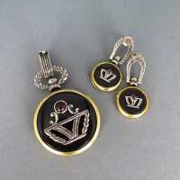 Jewelry set with pendant and earrings in silver and gold...