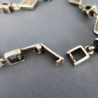 Dezentes Damen Glieder Armband in Silber mit Granatsteinen und Markasiten 