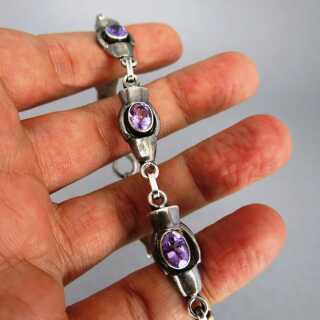 Woman link bracelet in sterling silver with violet amethyst cabochons