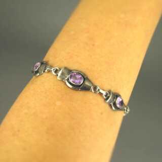 Woman link bracelet in sterling silver with violet amethyst cabochons