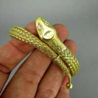 Exclusive massive 18 k gold snake woven bangle wid diamonds eyes